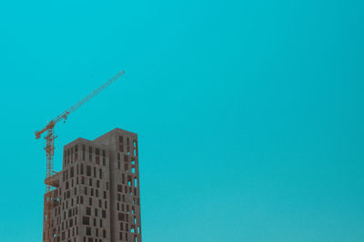 Low angle view of building against blue sky