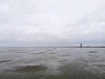 Lighthouse in low tide wadden sea