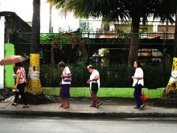 People playing on street in city