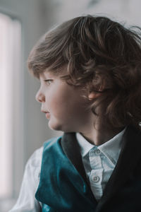 Close-up portrait of boy looking away