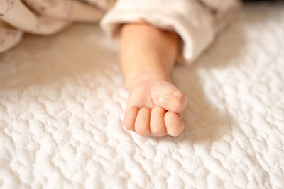 Low section of baby feet