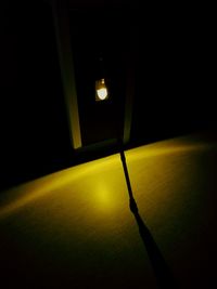 Close-up of illuminated lamp in darkroom