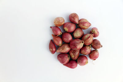 High angle view of raspberries against white background