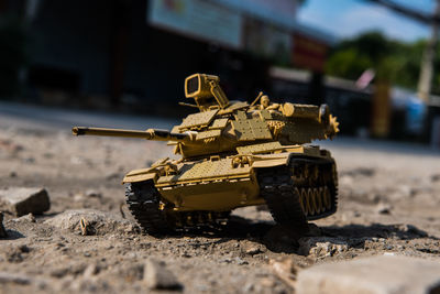 Close-up of toy army vehicle on land