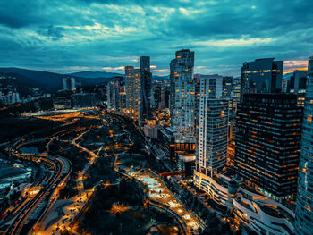 High angle view of illuminated cityscape against sky