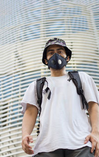 Portrait of a young man standing outdoors