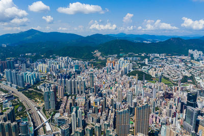 High angle view of modern buildings in city against sky