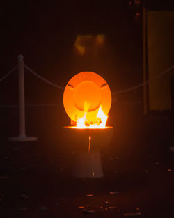 Low angle view of illuminated lamp post at night