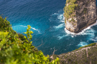 High angle view of rocks on sea