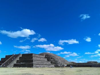 Low angle view of historical building against blue sky