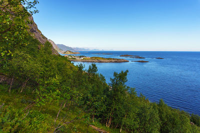 Scenic view of sea against clear blue sky