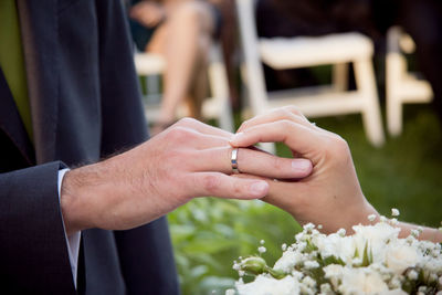 Close-up of cropped hand holding cigarette