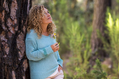 Side view of woman in tree