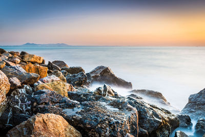 Scenic view of sea against sky during sunset