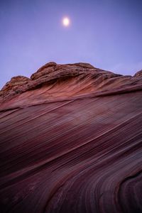 Low angle view of rock formation against clear sky