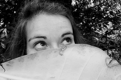 Portrait of woman against plants