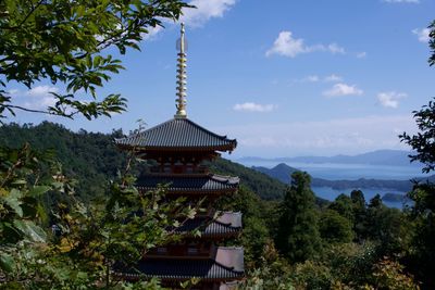 Temple against cloudy sky