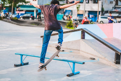 Full length of man skateboarding on skateboard