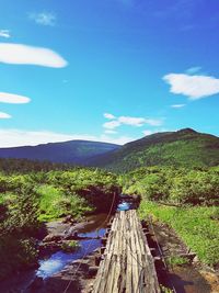 Scenic view of landscape against blue sky