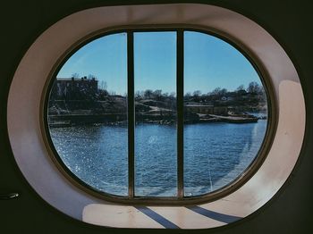 Close-up of sea seen through window