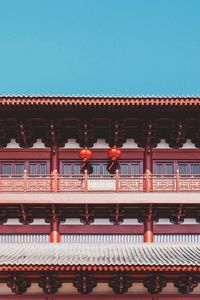 Low angle view of building against clear blue sky