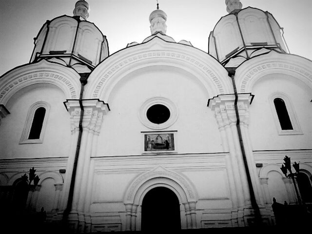 architecture, religion, built structure, church, arch, place of worship, low angle view, building exterior, facade, spirituality, arched, exterior, outdoors, architectural feature, high section, no people