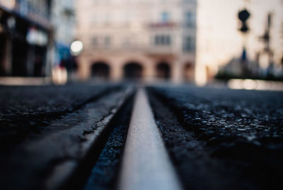 Surface level shot of railroad tracks on street