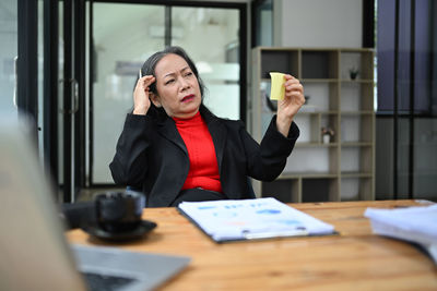 Portrait of businesswoman working at office