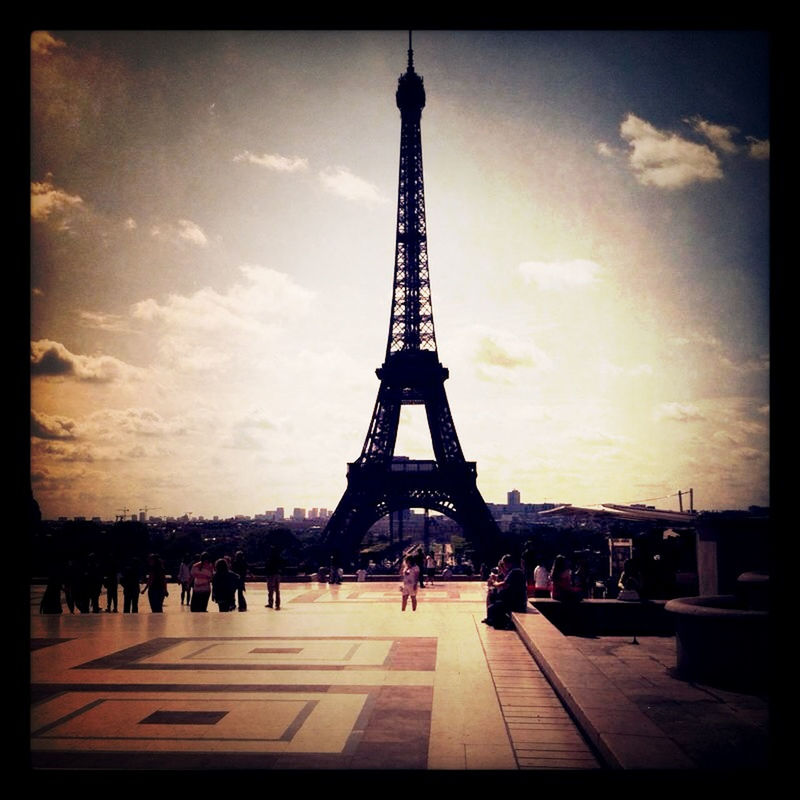 architecture, built structure, sky, large group of people, eiffel tower, building exterior, transfer print, famous place, travel destinations, international landmark, tower, city, tourism, capital cities, tall - high, cloud - sky, auto post production filter, travel, culture