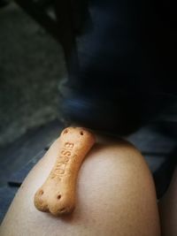 Low section of man sitting on table