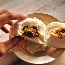 Close-up of hand holding ice cream