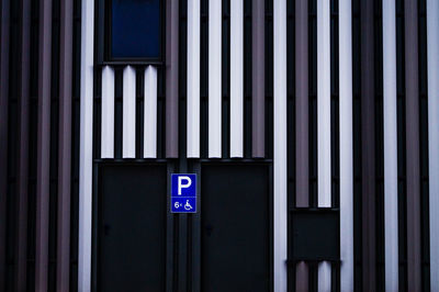 Disabled parking sign on wall