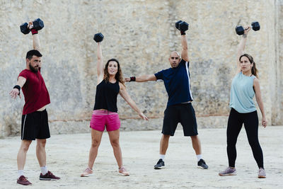 Athletes lifting crossfit weights in an urban enviroment.