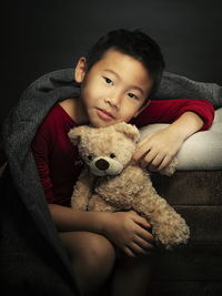 Portrait of baby girl with toy