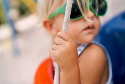 Close-up of boy holding hands