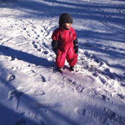 Full length of boy playing on white background