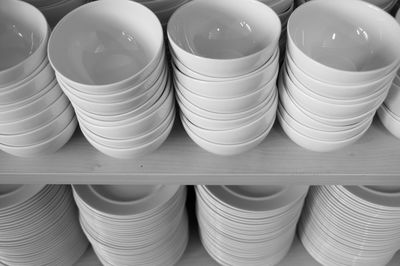 High angle view of bowls and plates stacks at store