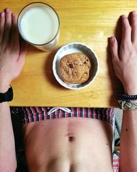 Directly above shot of man holding coffee cup