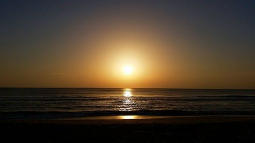 Scenic view of sea at sunset
