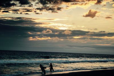 Silhouette of people on beach