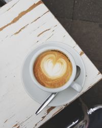 High angle view of cappuccino on table