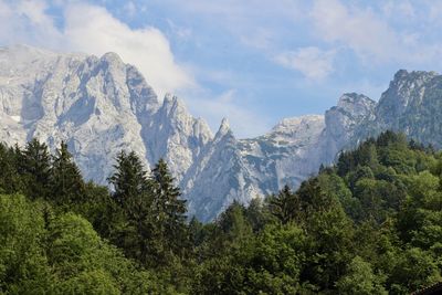 Scenic view of mountains against cloudy sky