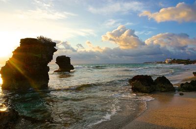 Scenic view of sea against cloudy sky