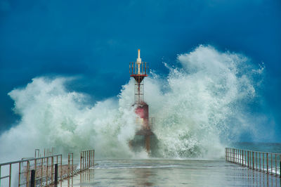 Panoramic view of lighthouse against sky