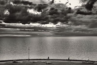 Scenic view of sea against cloudy sky