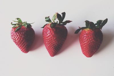 Close-up of strawberry over white background