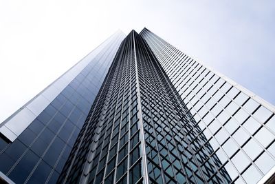 Low angle view of modern building against sky in city