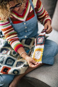 High angle view of woman holding crochet