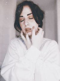 Portrait of a beautiful young woman in snow