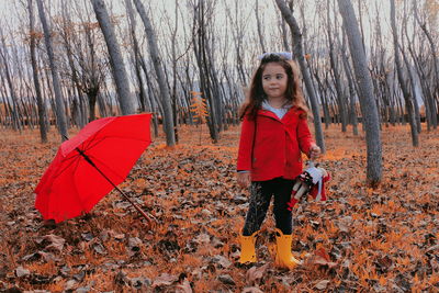 Portrait of girl standing in forest